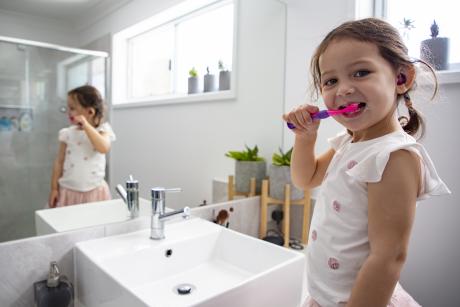 Brisbane youngster Emily Williams 3, saves water by brushing her teeth with the tap off..jpg