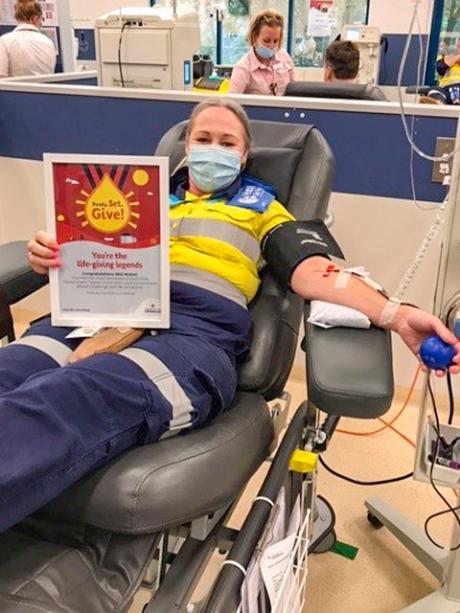 Seqwater Dam Operator Shannon McNamara rolls her sleeve up to give blood