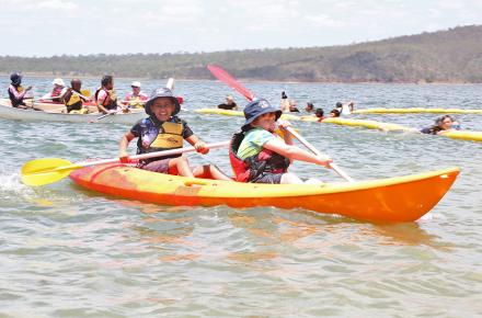 Children enjoy canoeing on Lake Wivenhoe at Billies Bay for Play it safe day in 2016