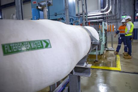 Gold Coast Desalination Plant Maintenance Planner Brian Woods and Project Engineer Daryl Harding pictured in the facility's pump room