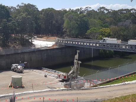 Spillway dowels and temporary bridge