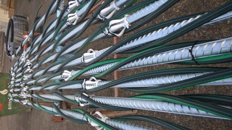 Steel cables pin the spillway to the bedrock