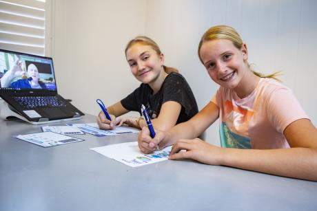 Wavell Heights youngsters Ava Hall, 14 and Charlotte Balke, 12, take part in a H2O Kids online lesson.jpg