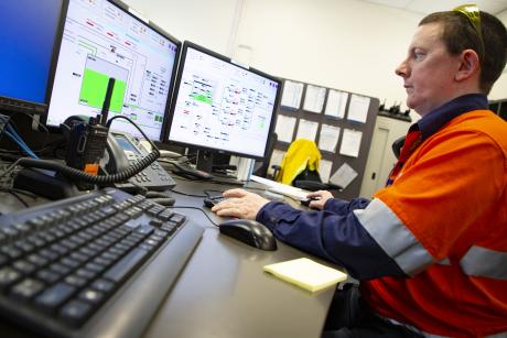 Gold Coast Desalination Plant  Operator-Maintainer Michael Rae working in the control room of the plant.