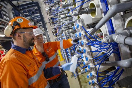 Gold Coast Desalination Plant Manager Tina Feenstra and Operations Supervisor Filippo Vico conduct water sampling in the plant's reverse osmosis room