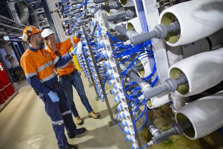 Gold Coast Desalination Plant Manager Tina Feenstra and Operations Supervisor Filippo Vico conduct water sampling in the plant's reverse osmosis room