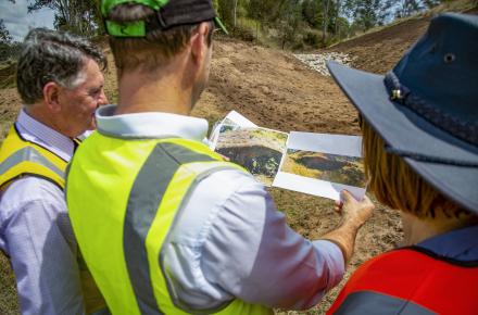 Seqwater CEO Neil Brennan with Healthy Land and Water Project Manager Mark Waud and  HLW CEO Julie McLellan where work has been undertaken to stabilise an eroding gully site along the mid-Brisbane River and re-vegetate the area.