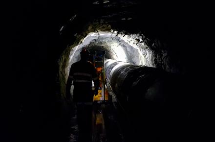 Workers inside the Blackall Range tunnel which houses a critical bulk water pipeline