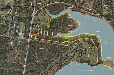 An aerial map of Leslie Harrison Dam showing a yellow outlined area where a planned burn will take place