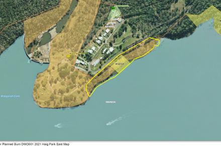 A yellow outline of the area subject to the planned burn on the shoreline of Lake Moogerah