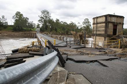 The Mt Crosby Weir Bridge has been closed after it was damaged by floodwaters 