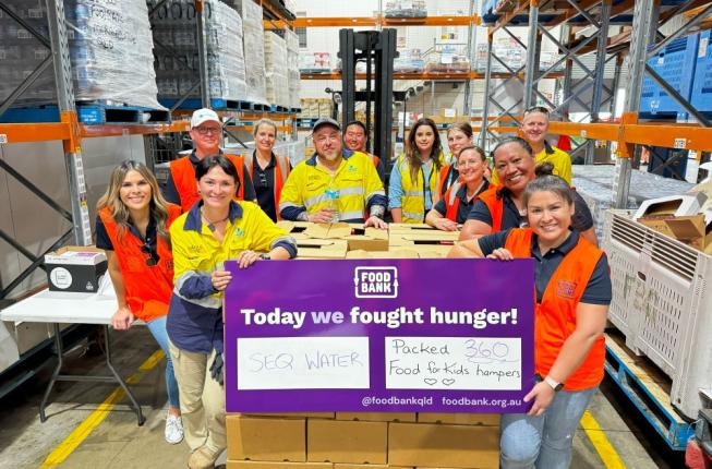 Group of staff holding sign saying we fought hunger today